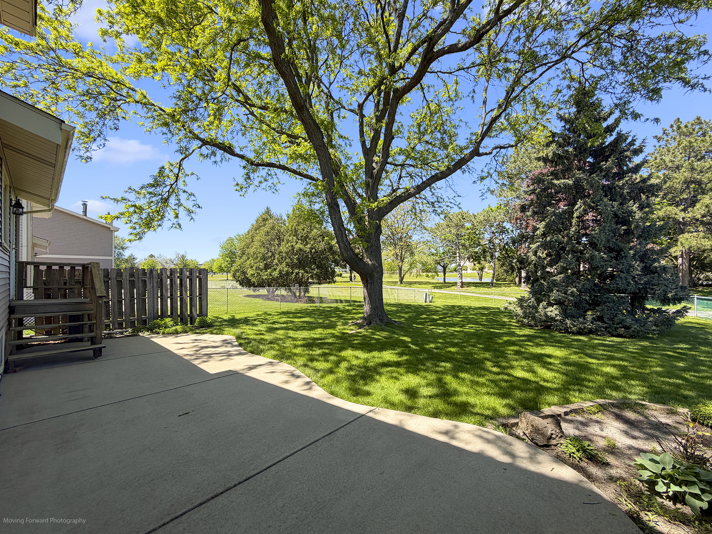 1570 West Goldengate Drive Addison, IL 60101 - Photo 13 of 34 a view of a street with a bench and trees