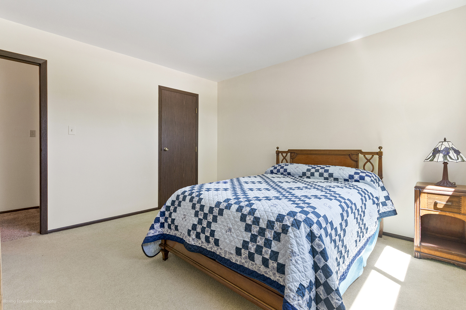 1570 West Goldengate Drive Addison, IL 60101 - Photo 23 of 34 a bedroom with a bed and lamp