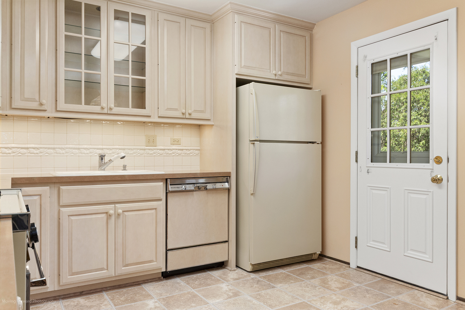 1570 West Goldengate Drive Addison, IL 60101 - Photo 7 of 34 a white refrigerator freezer sitting inside of a kitchen
