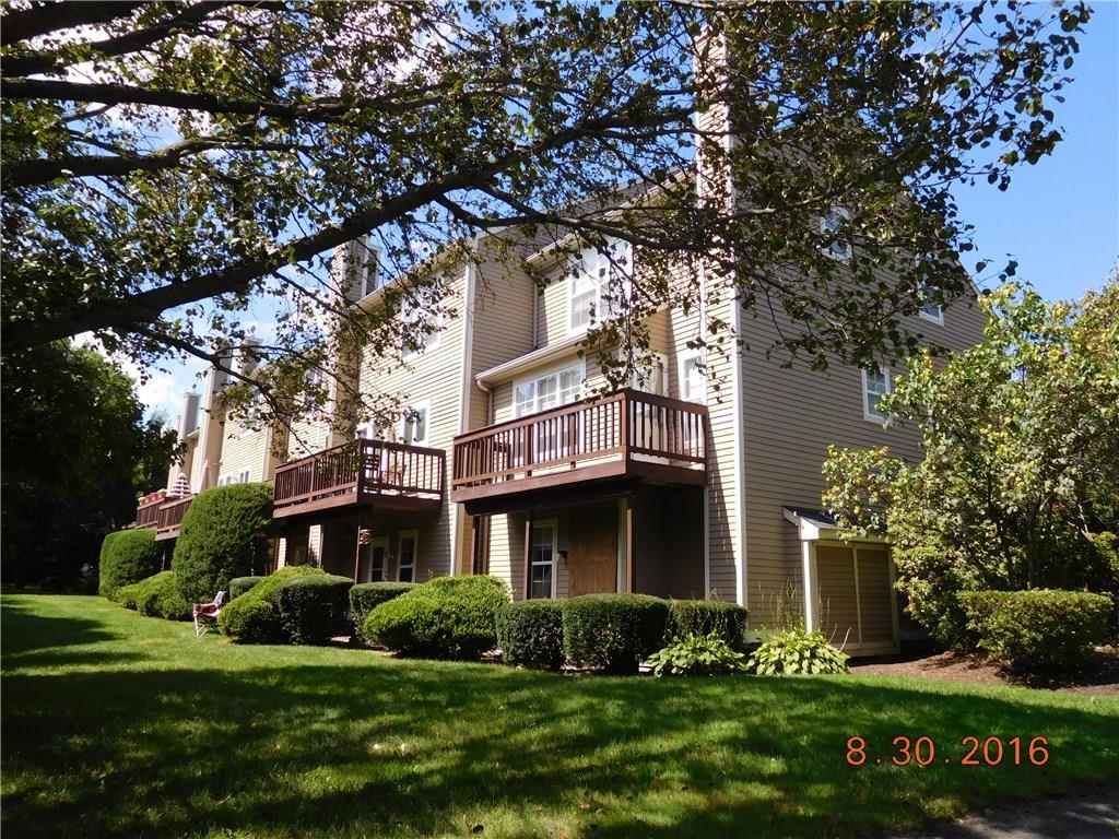 101 Paugusett Circle, Unit 101 Trumbull, CT 06611 - Photo 1 of 1 a front view of a house with a yard