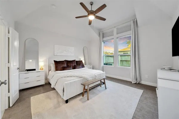 a spacious bathroom with double vanity a bathtub mirror and shower