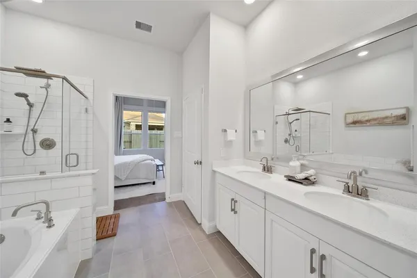 a view of walk in closet with clothes