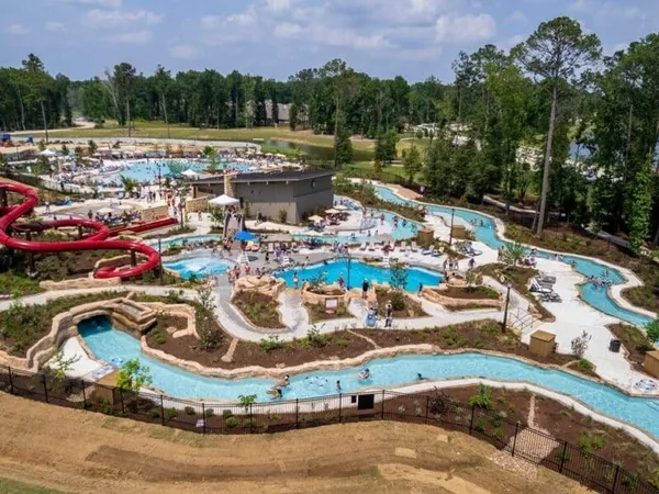 a view of a house with a yard and a trees