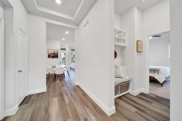 a view of kitchen and dining room with wooden floor