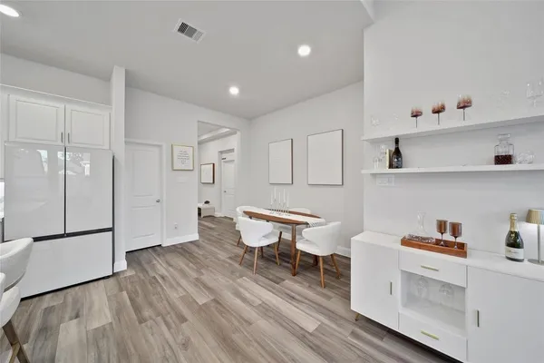 a view of a room with wooden floor and shelf