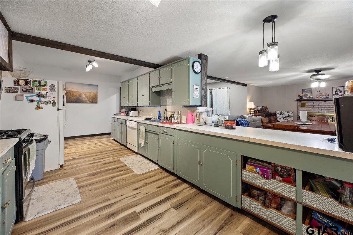 429 Main Street Rusk, TX 75785 - Photo 13 of 26 a kitchen with stainless steel appliances granite countertop a sink and cabinets
