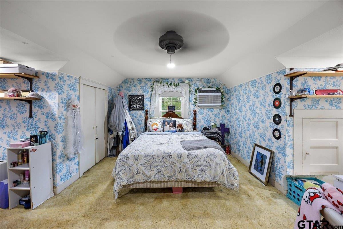 429 Main Street Rusk, TX 75785 - Photo 20 of 26 a spacious bedroom with a bed and a walk in closet