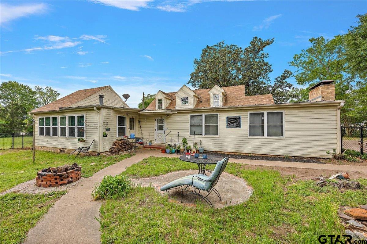 429 Main Street Rusk, TX 75785 - Photo 3 of 26 a front view of a house with a yard table and chairs