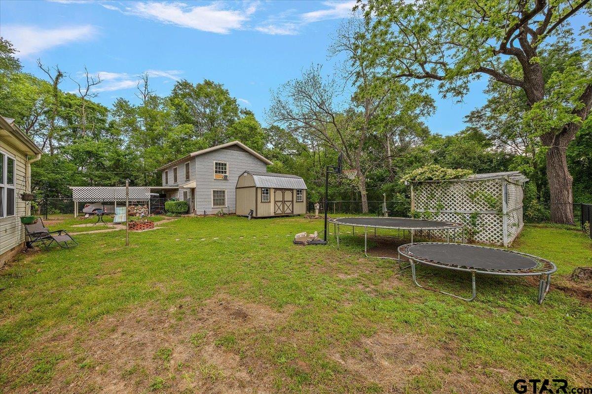 429 Main Street Rusk, TX 75785 - Photo 5 of 26 a front view of a house with garden