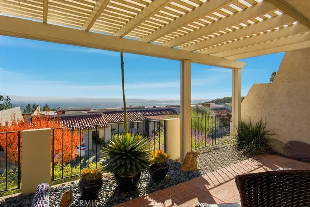 a view of a balcony with lake view and a floor to ceiling window