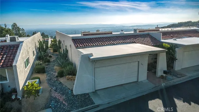 an aerial view of a house with a garden