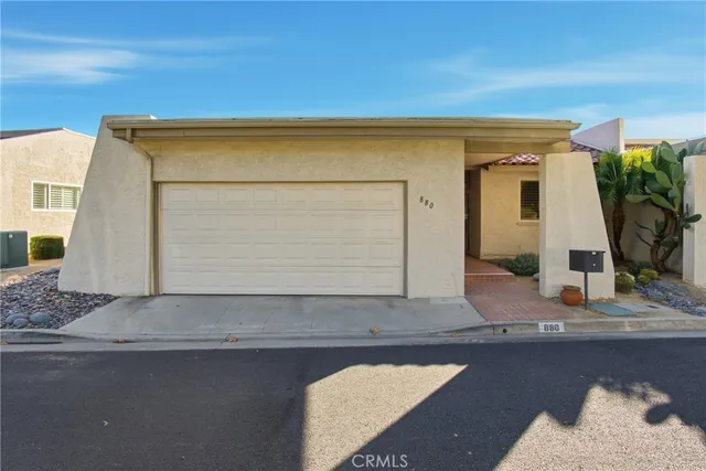 a bathroom with a tub and mirror
