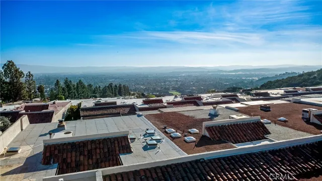 an aerial view of houses covered in trees
