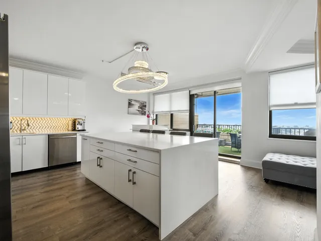 a kitchen with sink and cabinets