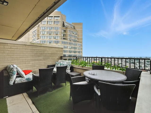 swimming pool view with a seating space