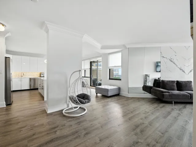 a view of a living room and hardwood floor