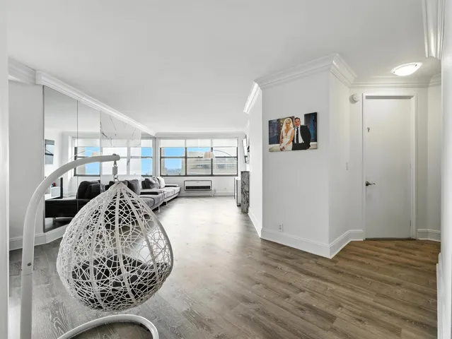 a view of a livingroom with furniture and window