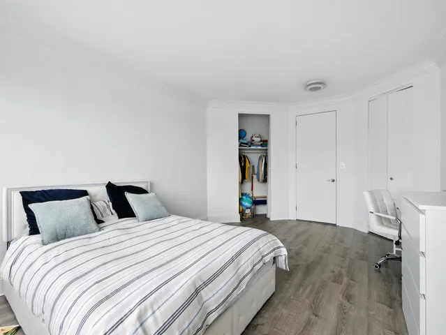 a bedroom with a bed and a closet