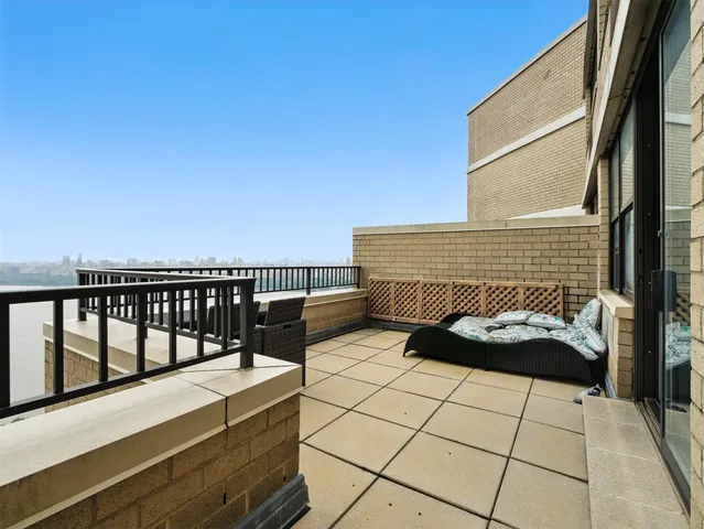 a view of balcony with furniture