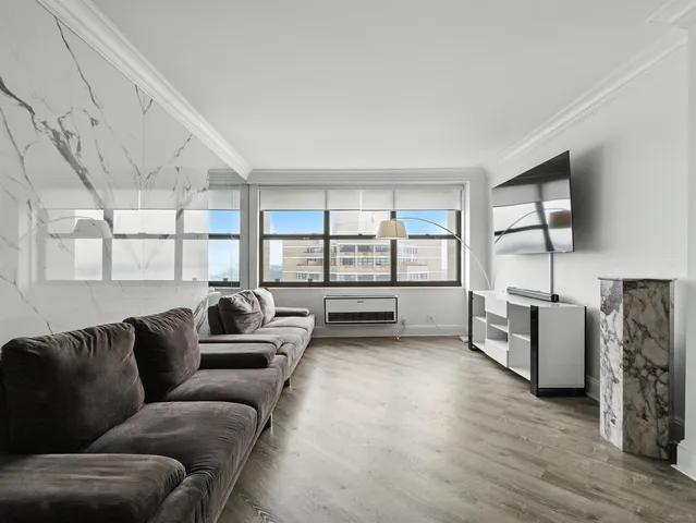 a living room with furniture and a window