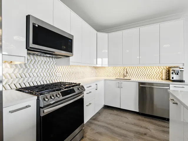 a kitchen with a stove and a microwave