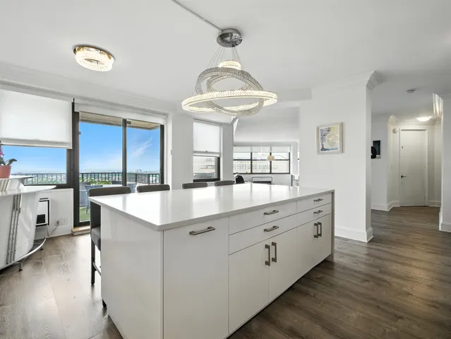 a kitchen with cabinets a sink and appliances