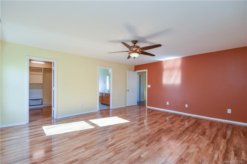 8716 Chalkstone Road Charlotte, NC 28216 - Photo 15 of 31 a view of empty room with wooden floor