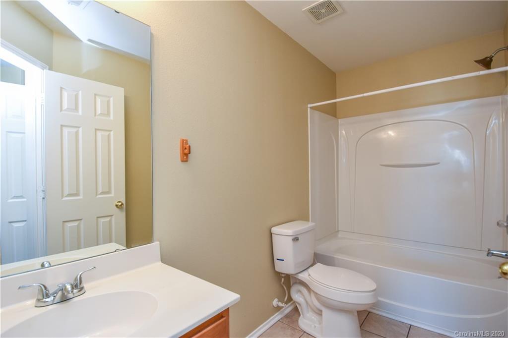 8716 Chalkstone Road Charlotte, NC 28216 - Photo 24 of 31 a bathroom with a sink toilet and shower