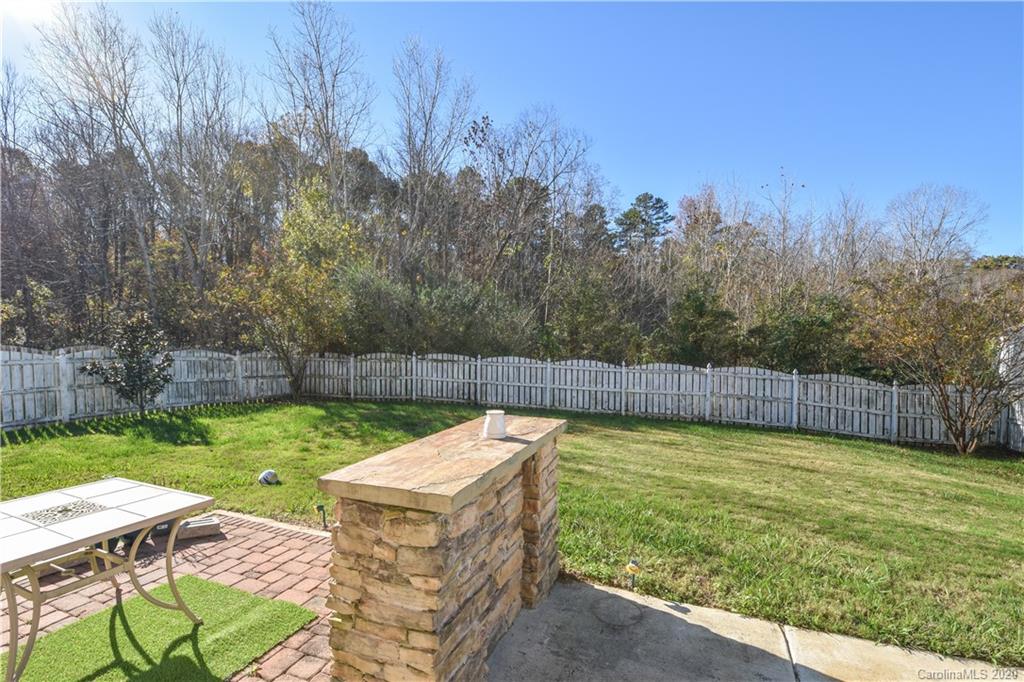 8716 Chalkstone Road Charlotte, NC 28216 - Photo 25 of 31 a view of a backyard with swimming pool