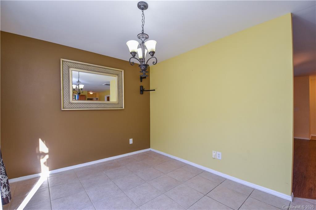 8716 Chalkstone Road Charlotte, NC 28216 - Photo 9 of 31 a view of livingroom with chandelier fan