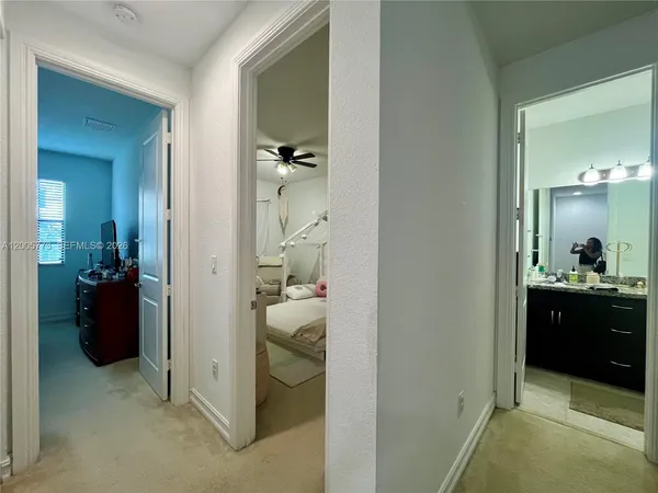a bed room with a bed and a mirror