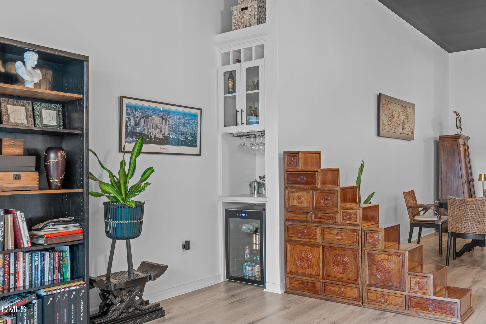 319 Fayetteville Street, Unit 410 Raleigh, NC 27601 - Photo 13 of 28 a living room with furniture a bookshelf and a potted plant