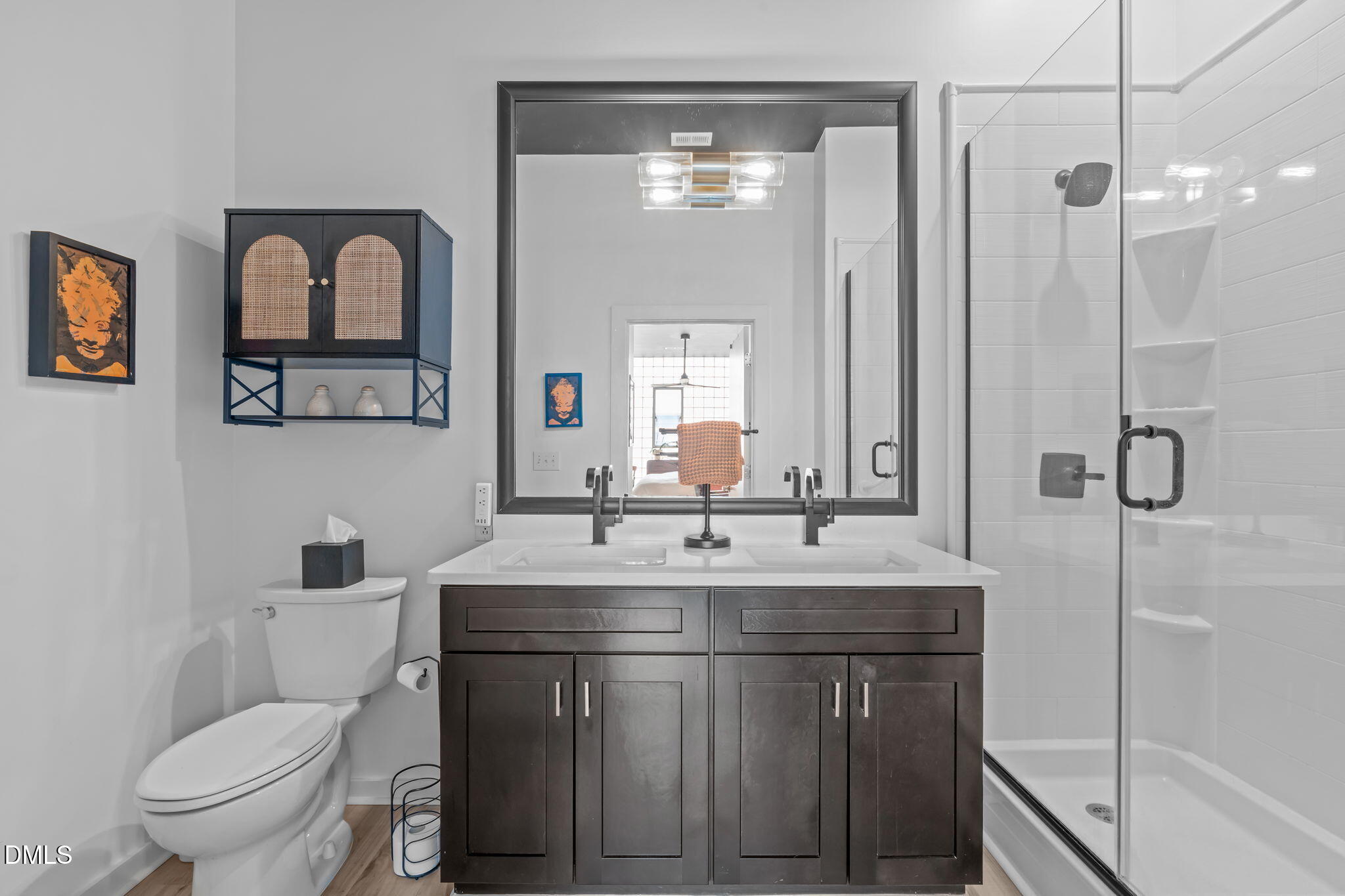 319 Fayetteville Street, Unit 410 Raleigh, NC 27601 - Photo 23 of 28 a bathroom with a toilet sink and mirror