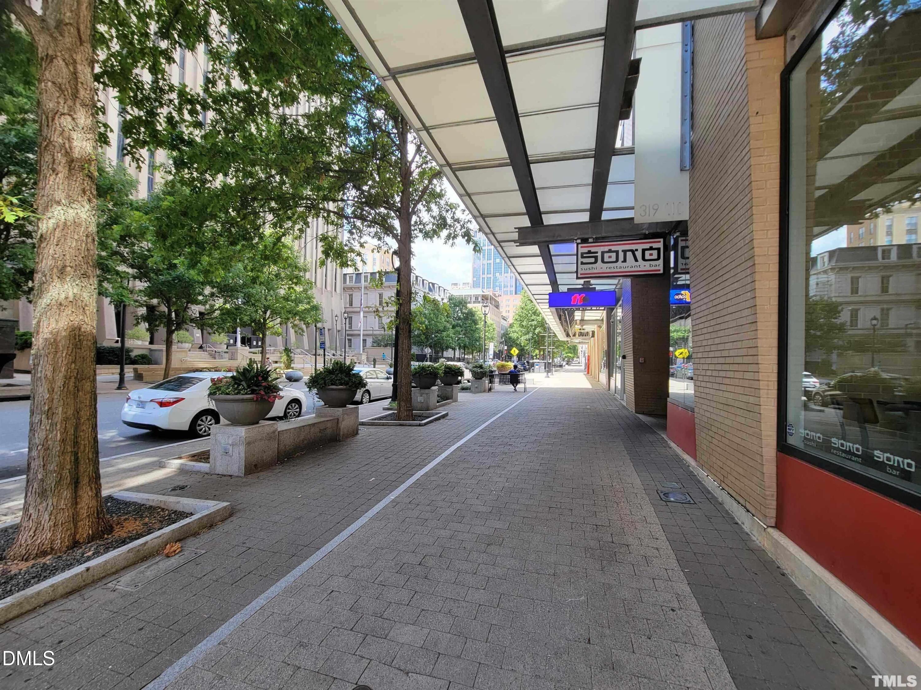 319 Fayetteville Street, Unit 410 Raleigh, NC 27601 - Photo 28 of 28 a view of a cars park in front of a building