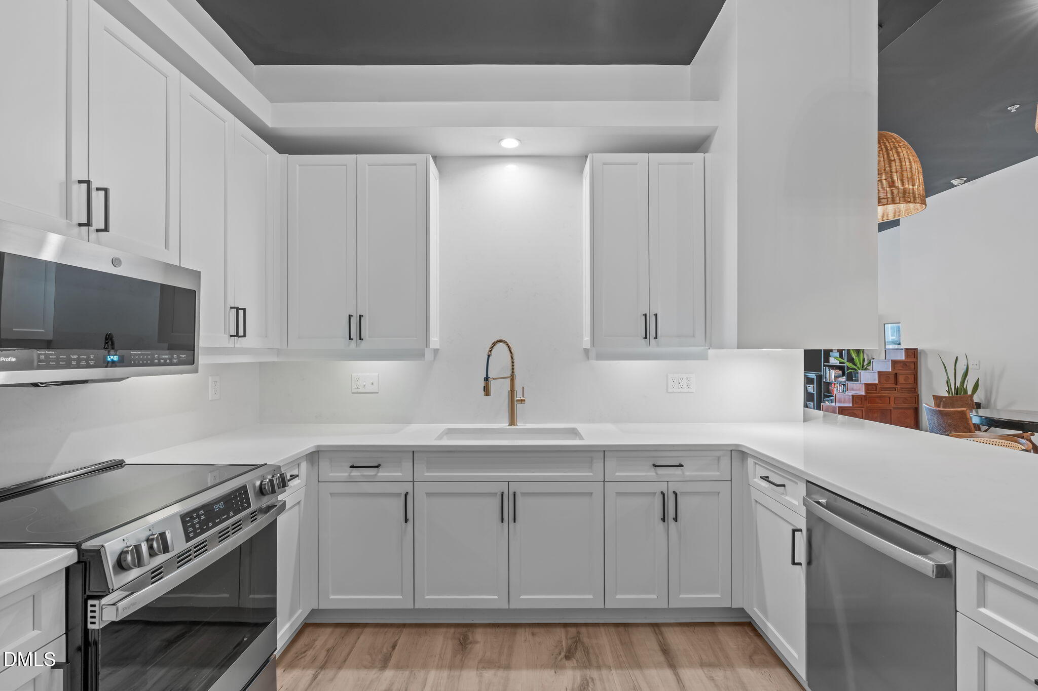 319 Fayetteville Street, Unit 410 Raleigh, NC 27601 - Photo 6 of 28 a kitchen with white cabinets and appliances