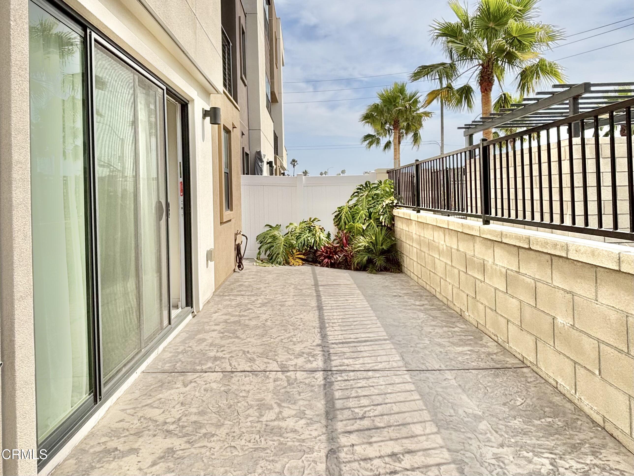 1105 Canal Street Oxnard, CA 93035 - Photo 6 of 14 a view of a pathway both side of house