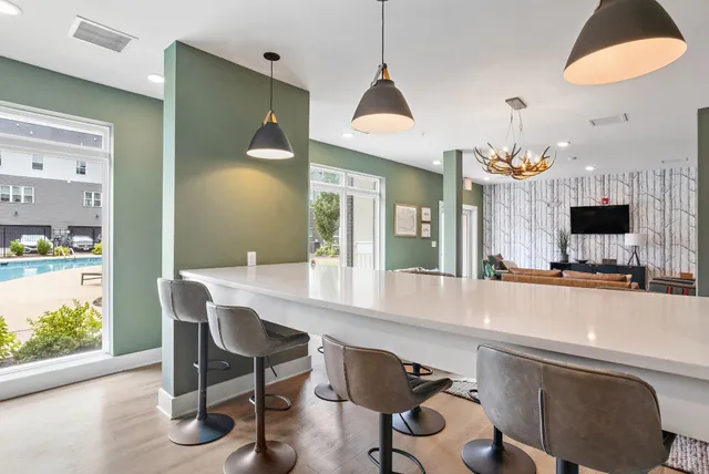 a room with a sink and a chandelier