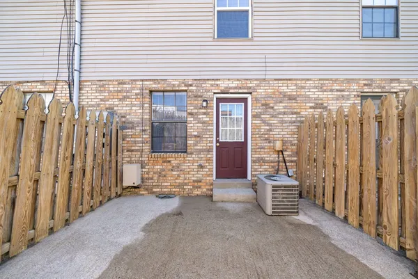 a view of front door with a house