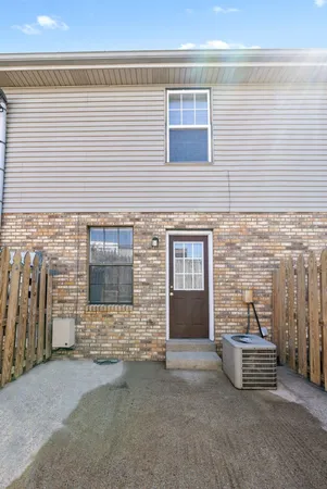 a front view of a house with parking space