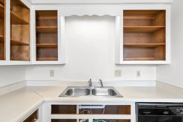 a kitchen with a sink and a window