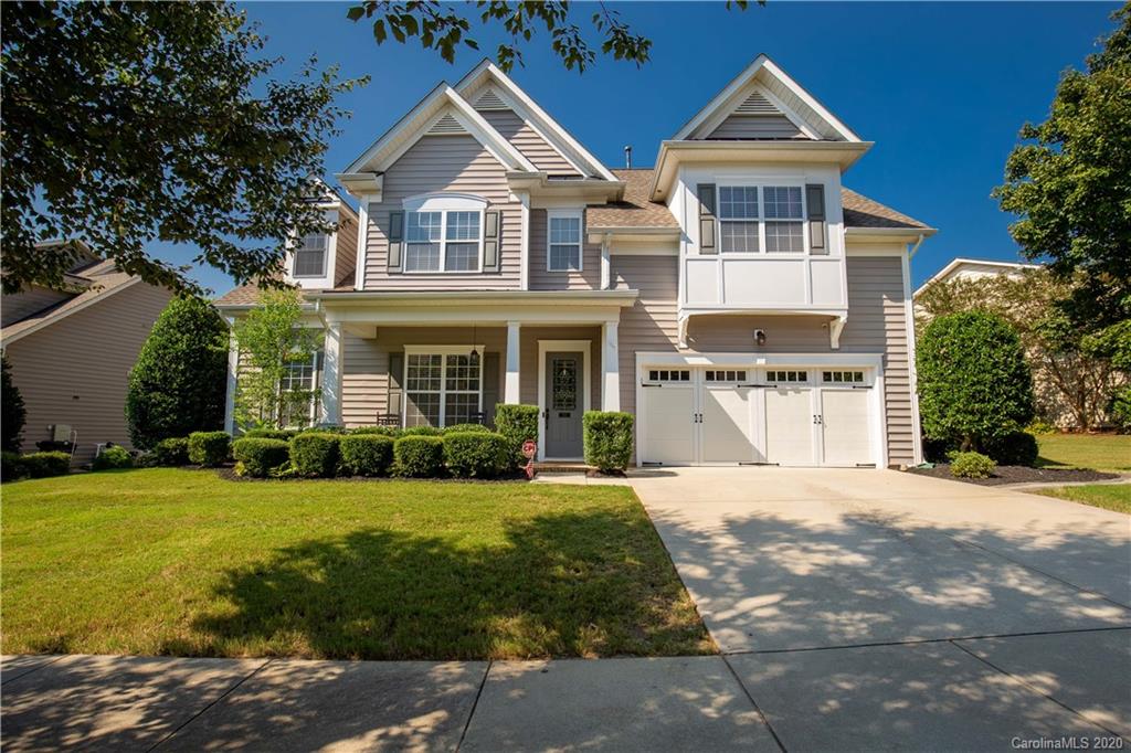 313 Miners Cove Way Fort Mill, SC 29708 - Photo 1 of 38 a front view of a house with a yard and garage
