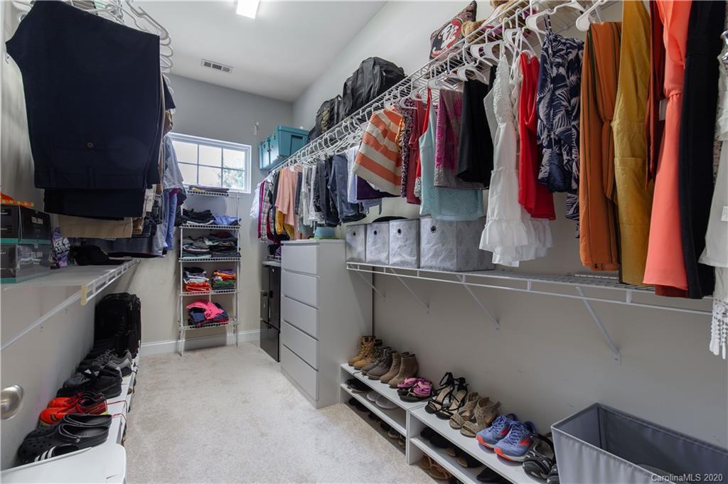 313 Miners Cove Way Fort Mill, SC 29708 - Photo 19 of 38 a view of walk in closet with clothes and shoes