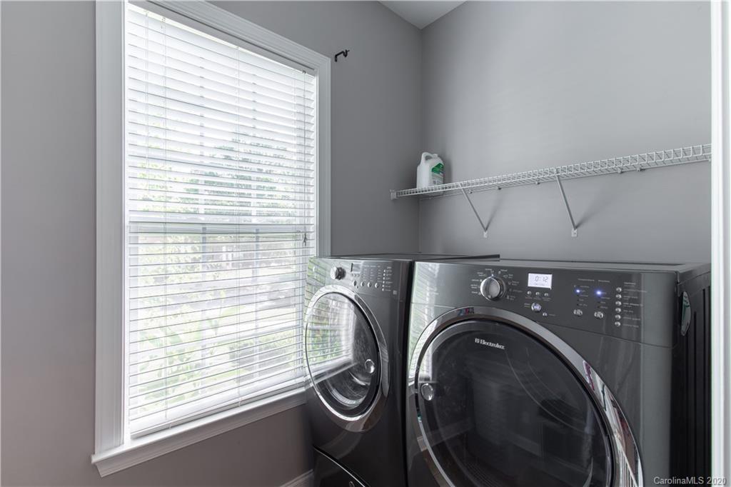 313 Miners Cove Way Fort Mill, SC 29708 - Photo 20 of 38 a utility room with dryer and washer