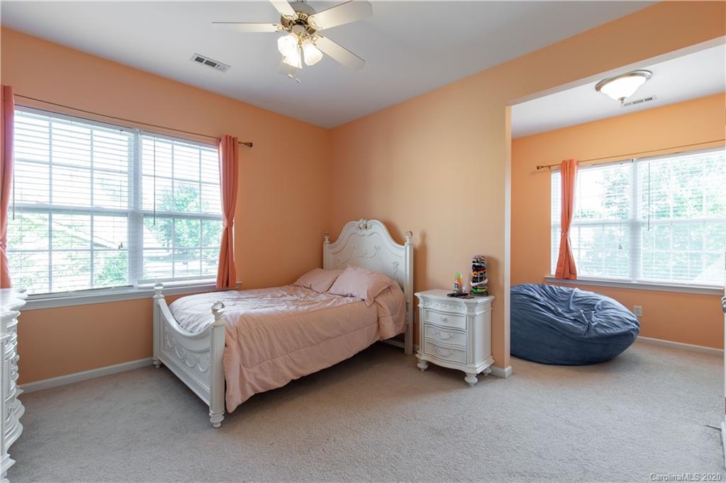 313 Miners Cove Way Fort Mill, SC 29708 - Photo 23 of 38 a bedroom with a bed and a window