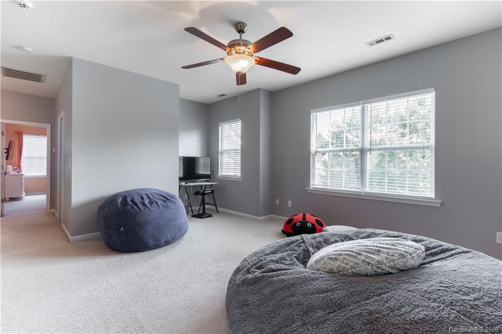 313 Miners Cove Way Fort Mill, SC 29708 - Photo 27 of 38 a bedroom with a bed and window