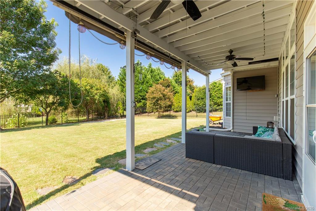 313 Miners Cove Way Fort Mill, SC 29708 - Photo 31 of 38 a view of a balcony with a floor to ceiling window next to a yard