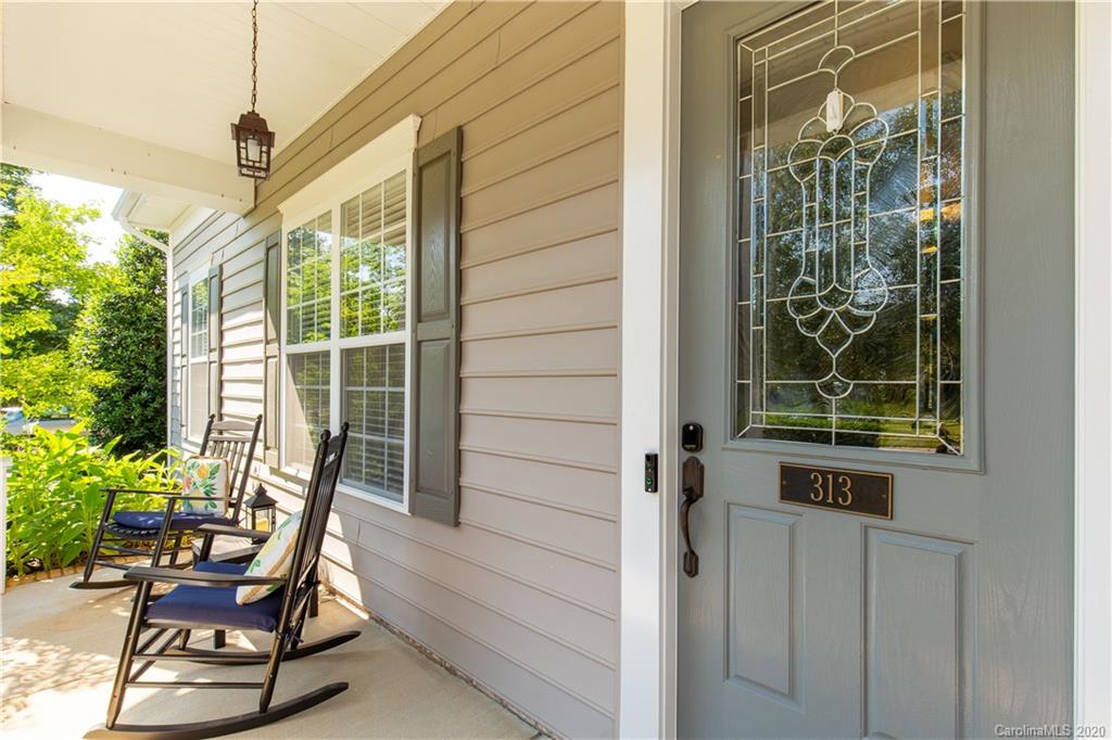 313 Miners Cove Way Fort Mill, SC 29708 - Photo 5 of 38 a balcony with table and chairs