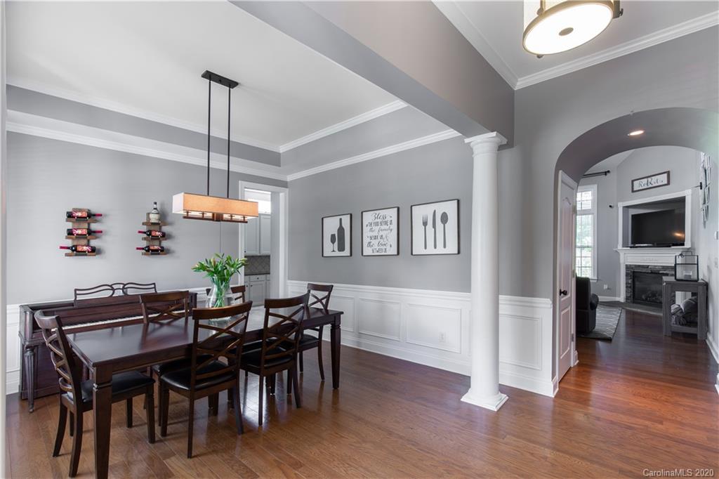 313 Miners Cove Way Fort Mill, SC 29708 - Photo 6 of 38 a view of a dining room with furniture and wooden floor