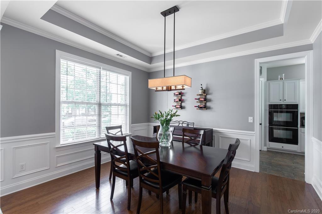 313 Miners Cove Way Fort Mill, SC 29708 - Photo 7 of 38 a view of a dining room with furniture window and wooden floor