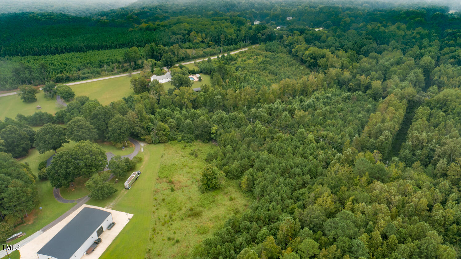 9841 Quail Roost Road Bahama, NC 27503 - Photo 8 of 12 a view of a yard with a lake view
